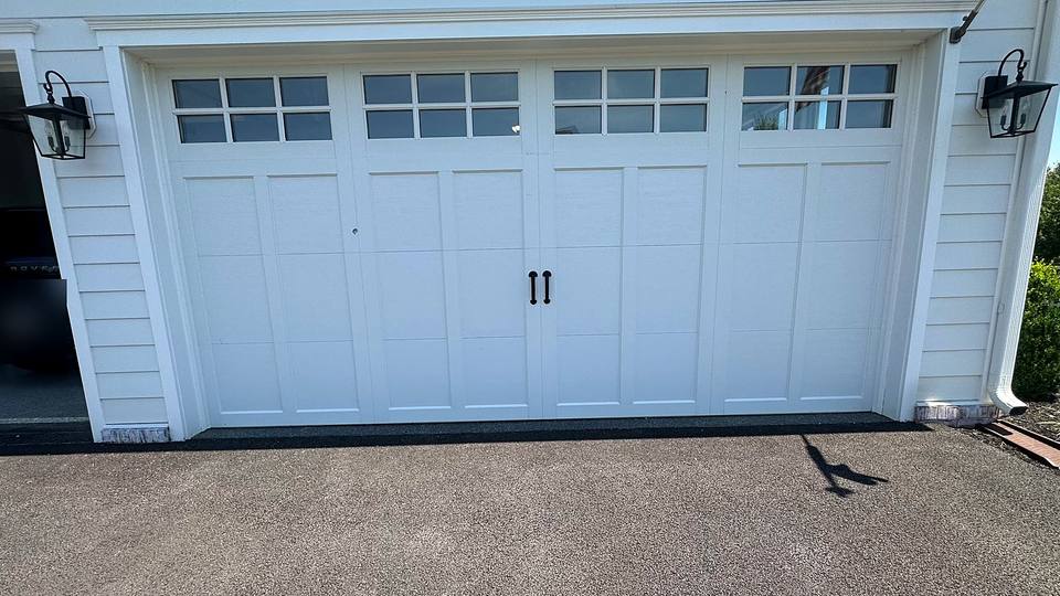 White carriage house garage door with windows