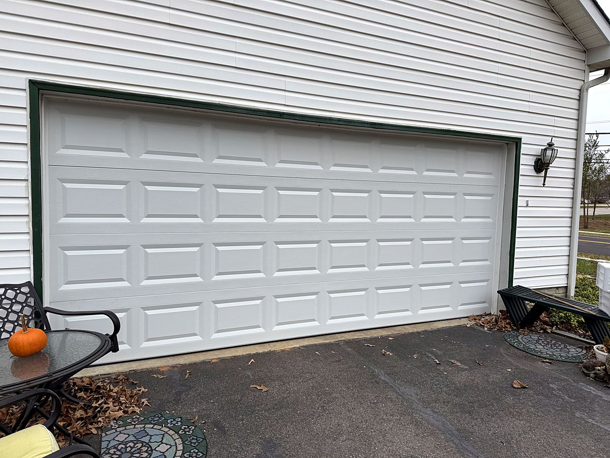 New white raised panel two car garage door in Ferndale