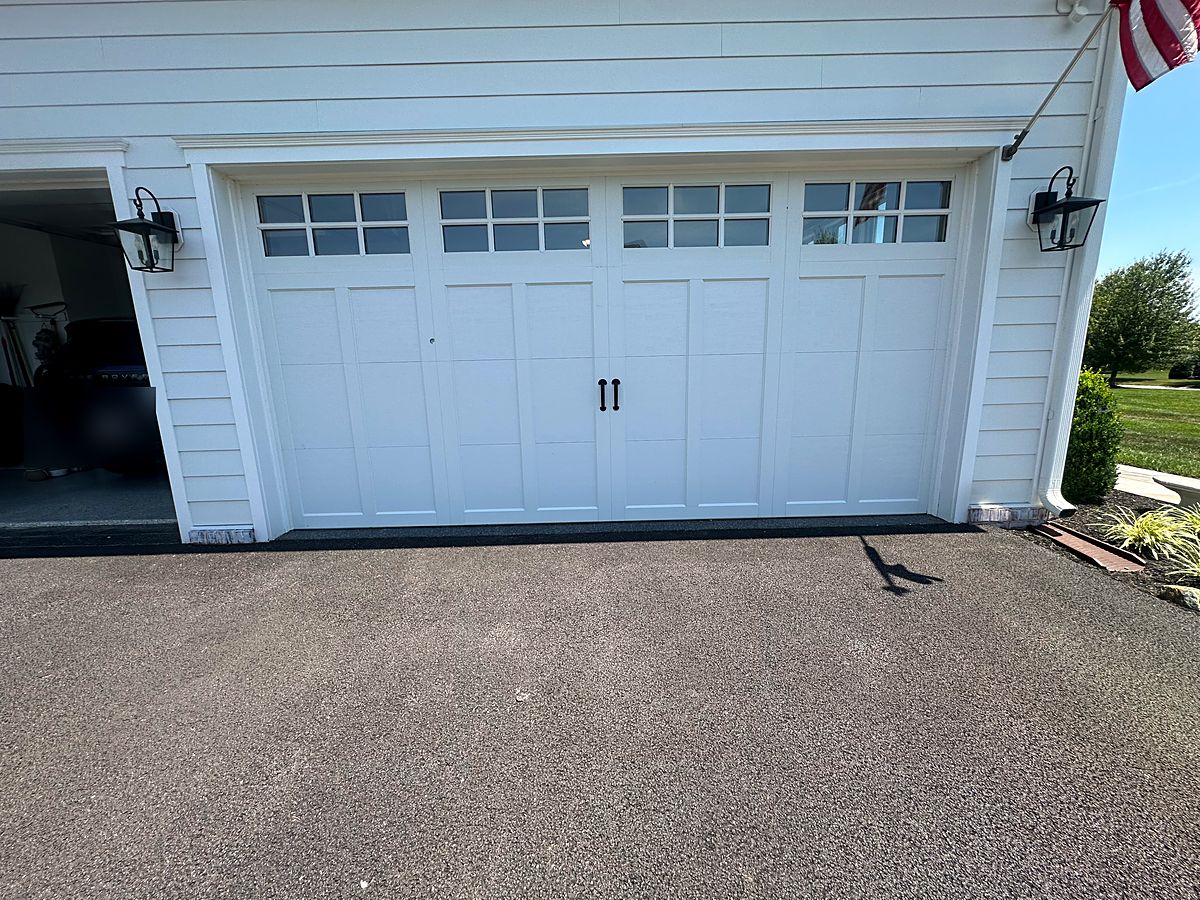 White carriage house garage door with windows on a home in Phoenix