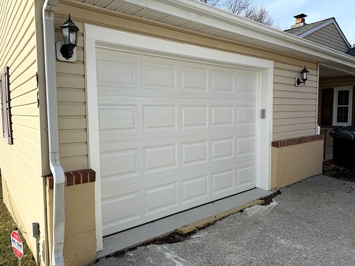 White raised panel garage door on a home in Reisterstown