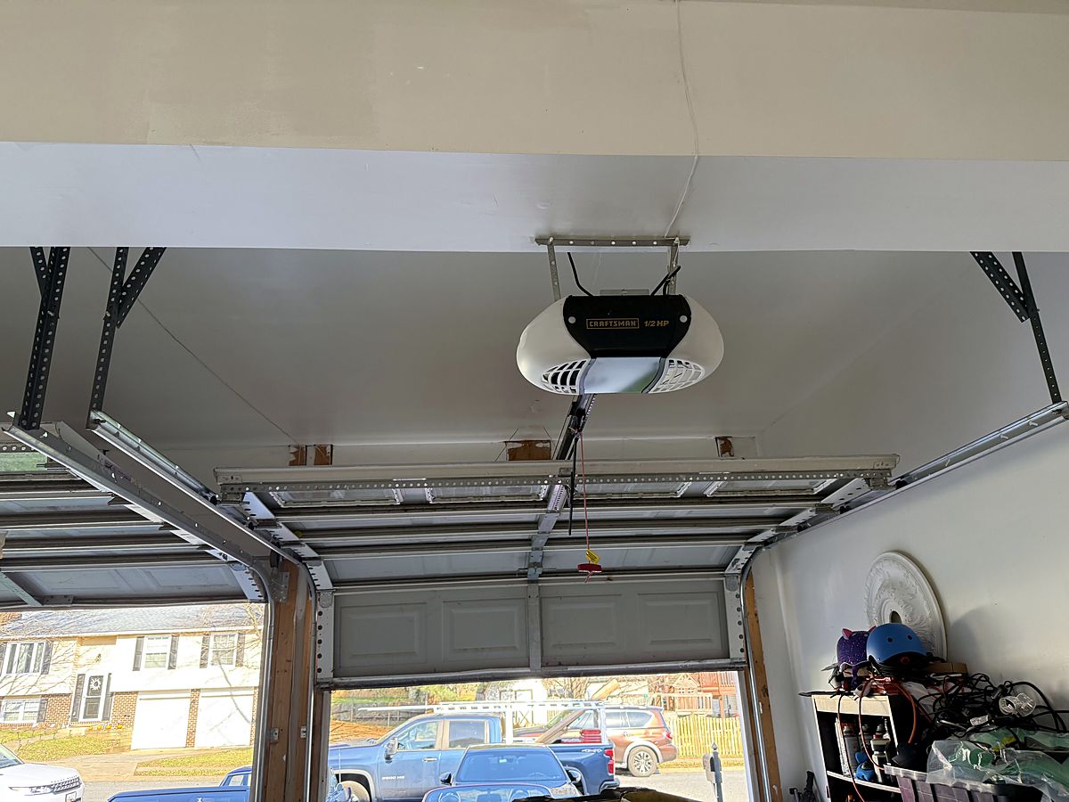 Ceiling mounted opener and steel door track in a Westminster garage