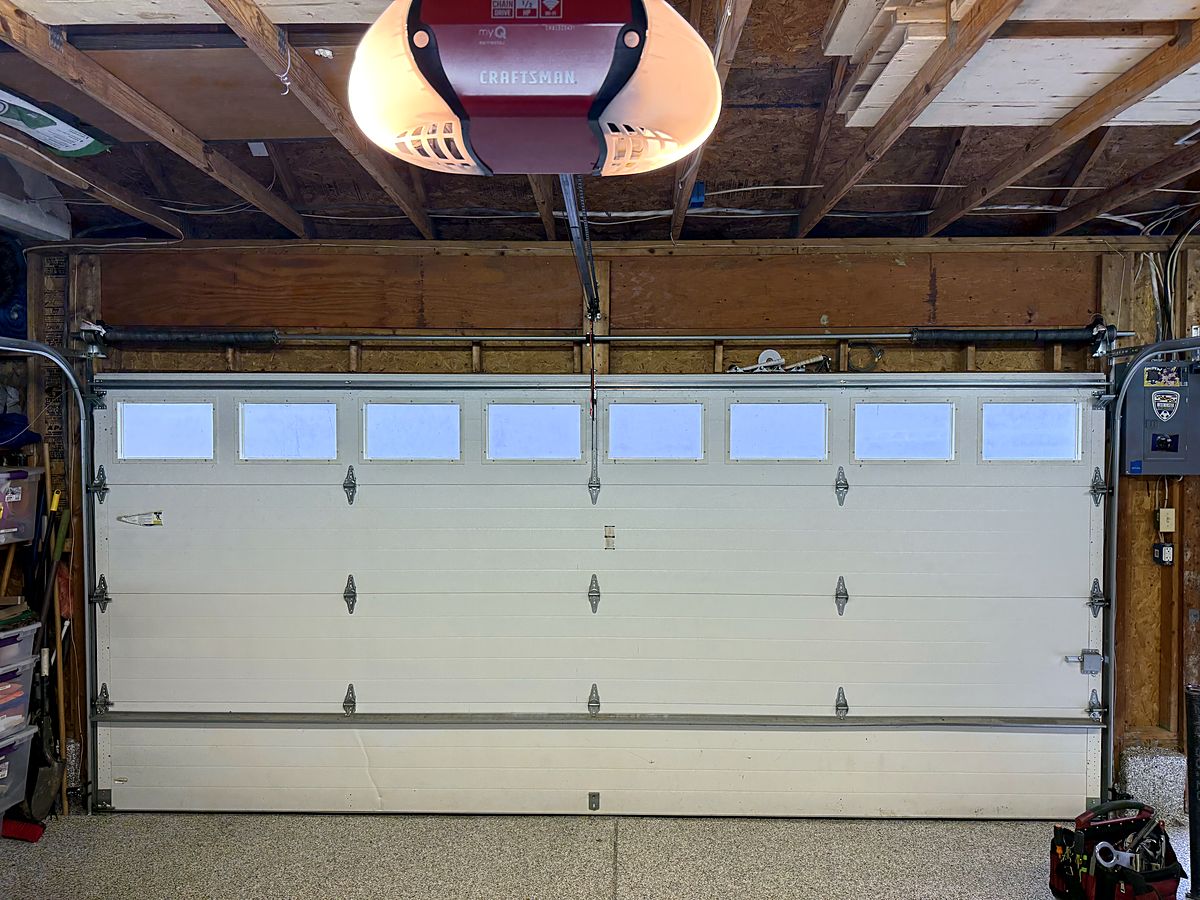 Insulated white garage door with a row of windows across the top, Westminster